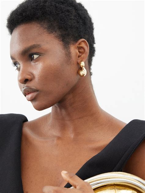 bottega veneta gold drop earrings.